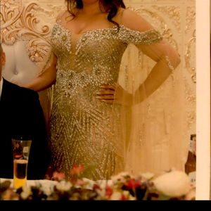 Gold custom haute couture gown from Nyc glamour boutique.